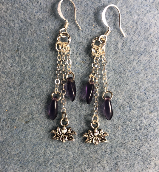 Small silver lotus flower charm earrings attached to silver chain and adorned with small purple Czech glass dagger beads