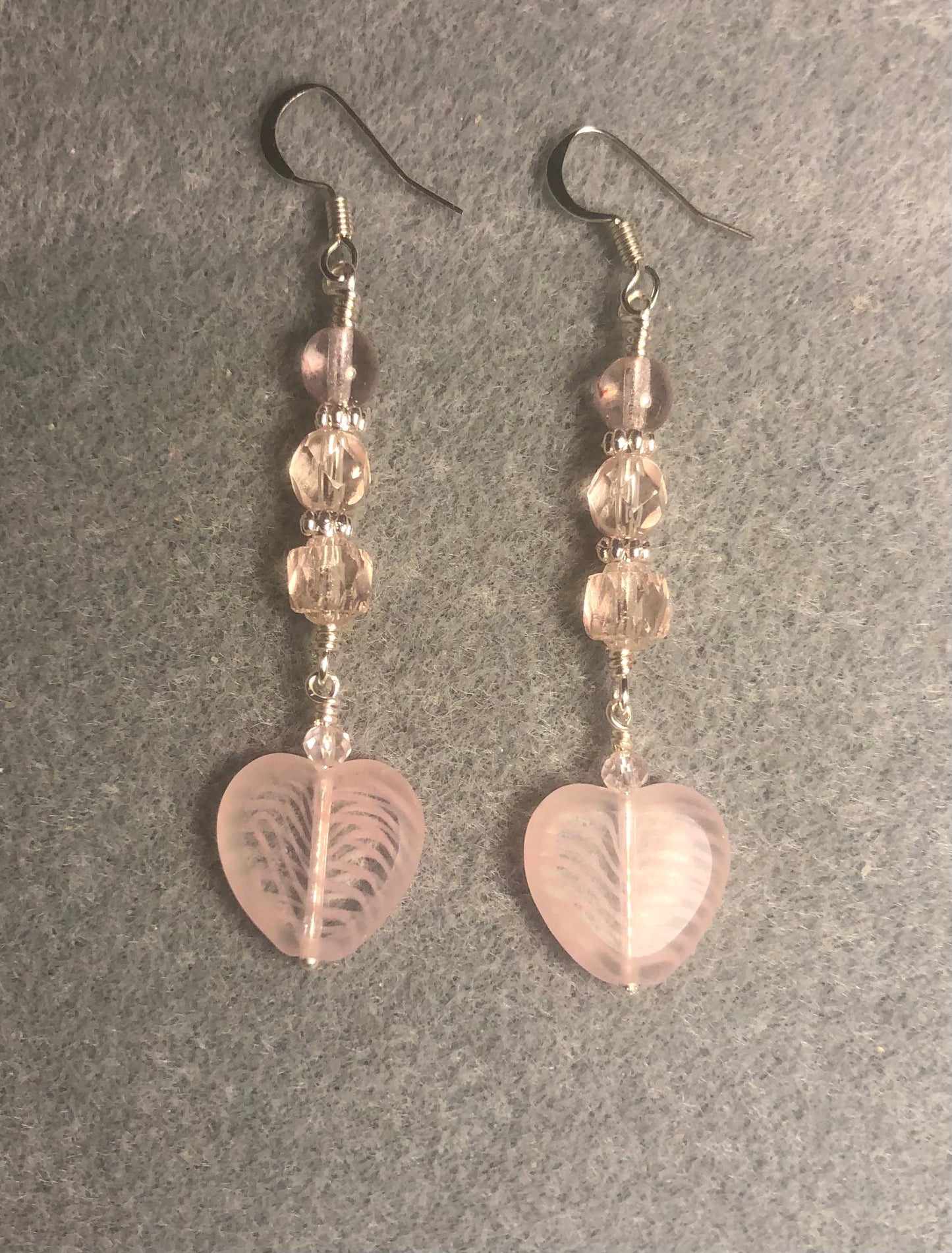 Light pink striped Czech glass heart bead earrings adorned with light pink Czech glass beads.