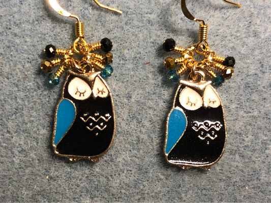 Black, turquoise, and white enamel sleepy owl charm earrings adorned with tiny dangling black, turquoise, and white Chinese crystal beads.