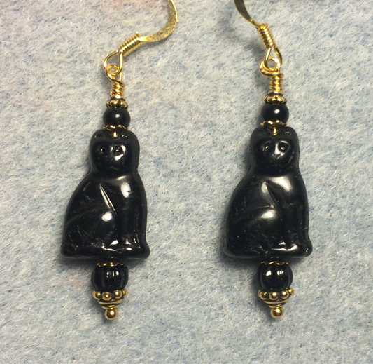 Shiny black Czech glass cat bead earrings adorned with black Czech glass beads.