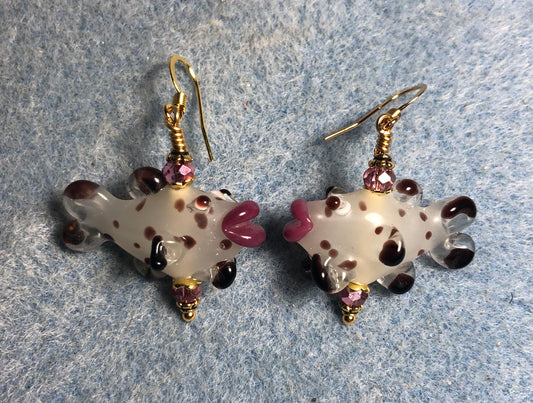 White, black, and pink lamp work kissing fish bead earrings adorned with pink Chinese crystal beads.