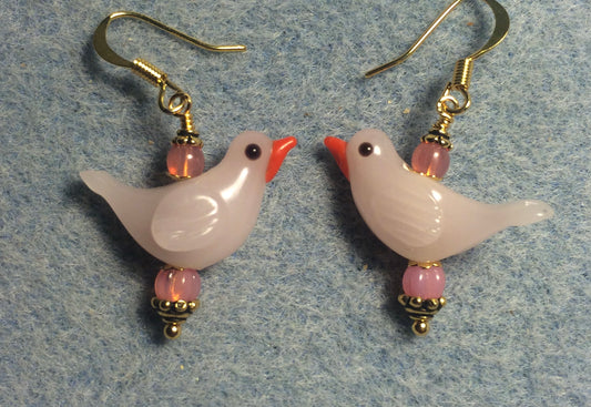 Milky pink lamp work songbird bead earrings adorned with pink Czech glass beads.