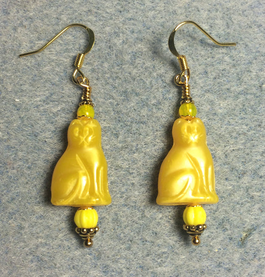 Yellow Czech glass cat bead earrings adorned with yellow Czech glass beads.