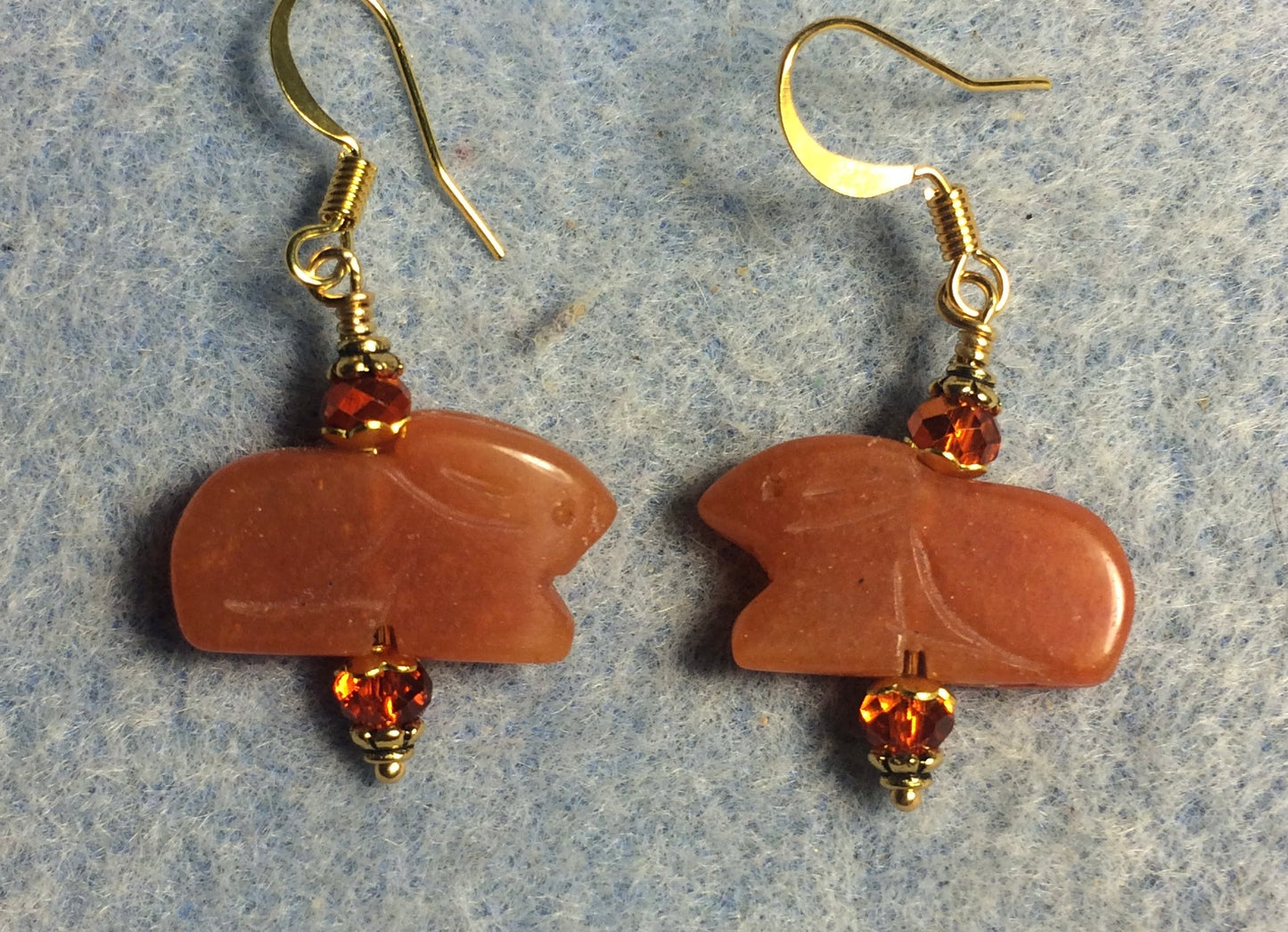 Orange aventurine gemstone Zuni rabbit bead earrings adorned with orange Chinese crystal beads.