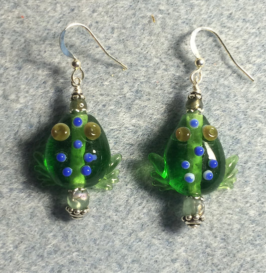 Transparent emerald green lamp work frog bead earrings adorned with green Czech glass beads.