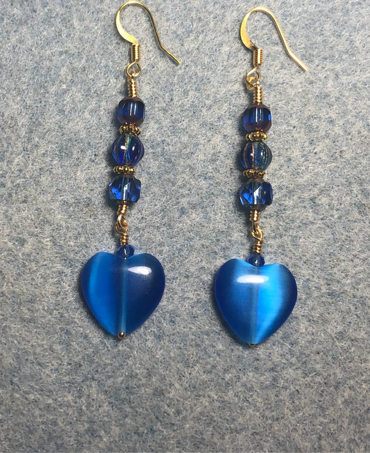 Bright blue fiber optic (cat’s eye) Czech glass heart bead earrings adorned with bright blue Czech glass beads.