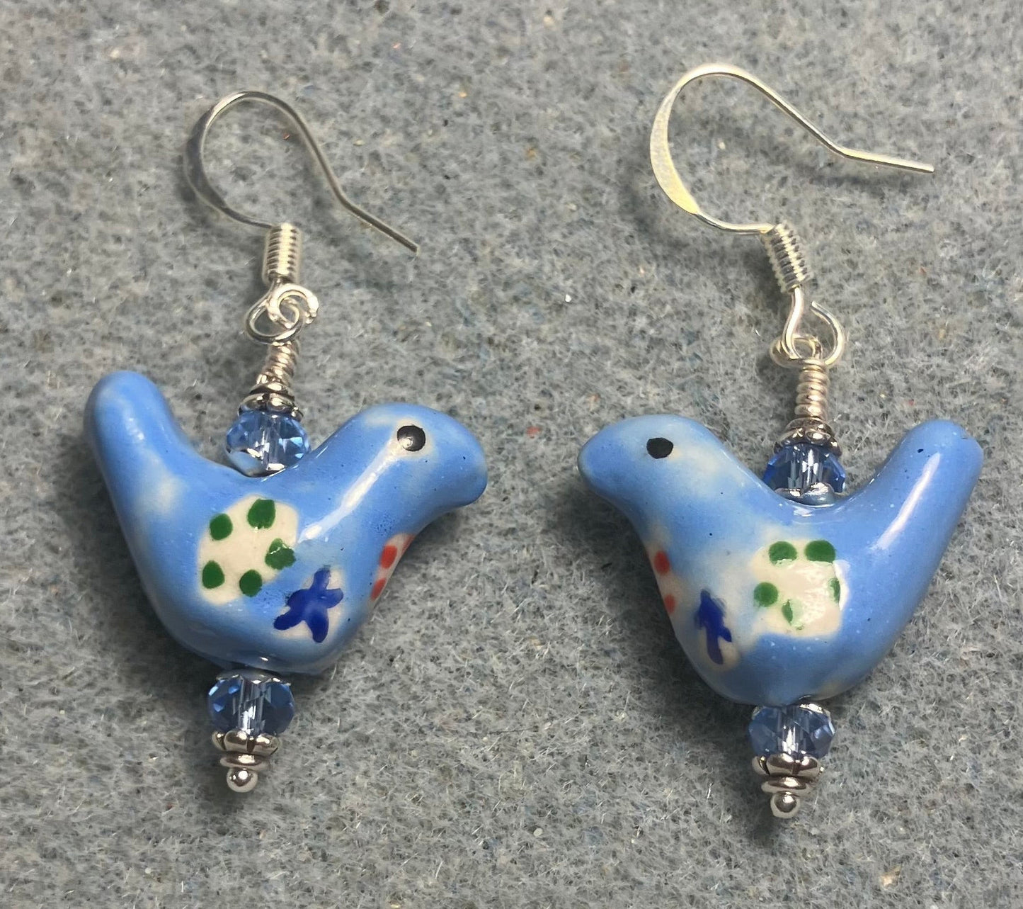 Small light blue, yellow, and green ceramic bird bead earrings adorned with light blue Chinese crystal beads.