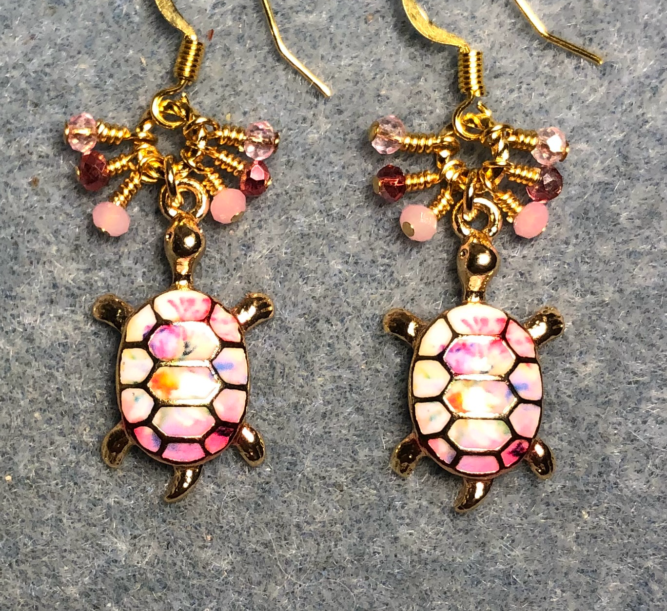 Pink, rose, and white enamel turtle charm earrings adorned with tiny dangling pink and rose Chinese crystal beads.