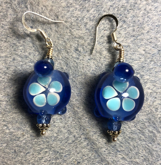 Dark blue lamp work turtle bead earrings adorned with dark blue Czech glass beads.