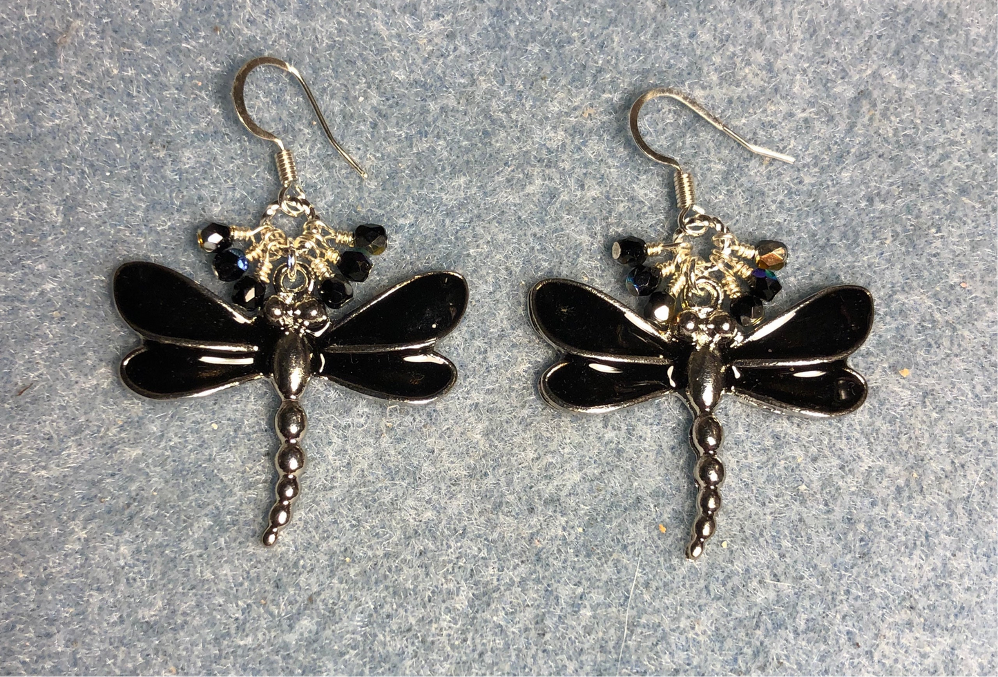 Large black and silver enamel dragonfly charm earrings adorned with tiny dangling black and silver Chinese crystal beads.