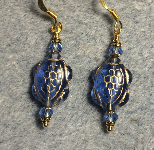 Light blue (with gold inlay) Czech glass turtle bead earrings adorned with light blue Chinese crystal beads.