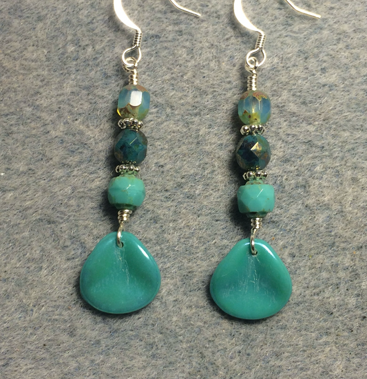 Opaque turquoise Czech glass rose petal earrings adorned with opaque turquoise Czech glass beads.