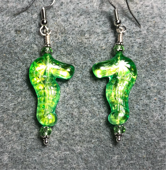 Shimmery green Czech glass seahorse bead earrings adorned with green Chinese crystal beads.
