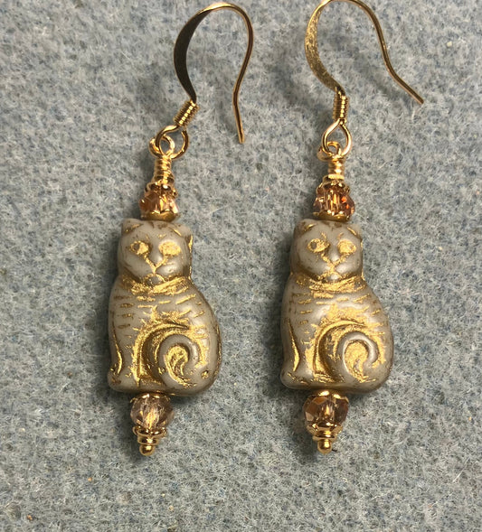Medium off white (with gold inlay) Czech glass cat bead earrings adorned with gold Chinese crystal beads.