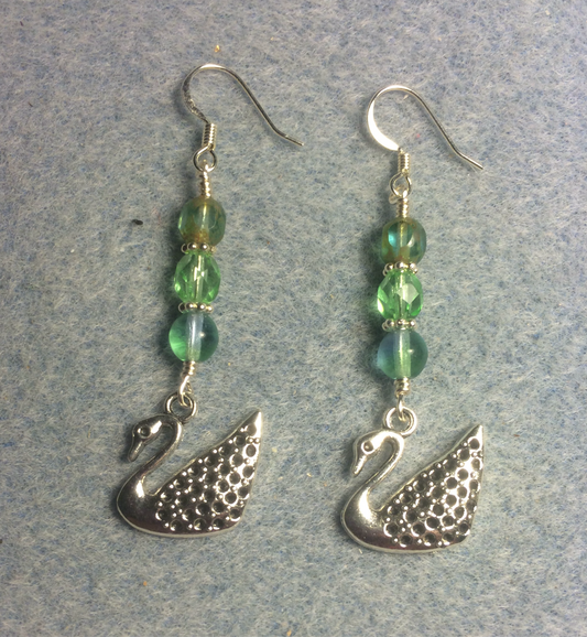 Silver swan charm earrings adorned with blue green Czech glass beads