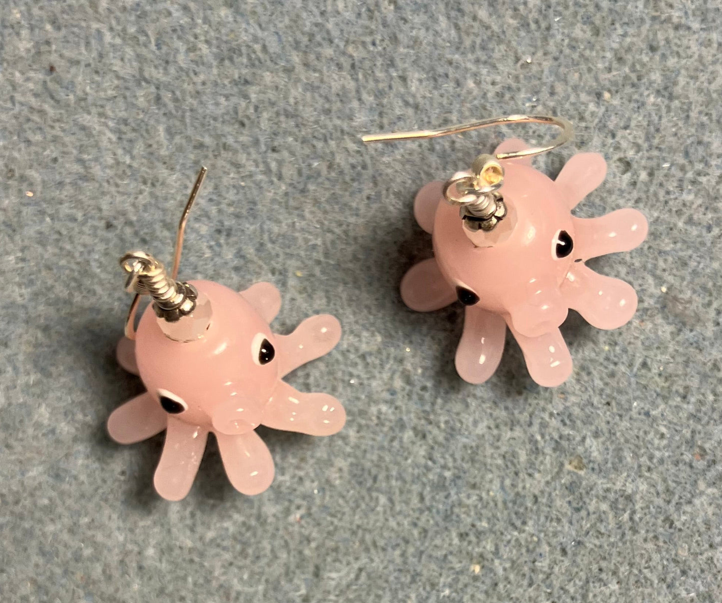 Pink lamp work octopus bead earrings adorned with pink Chinese crystal beads.