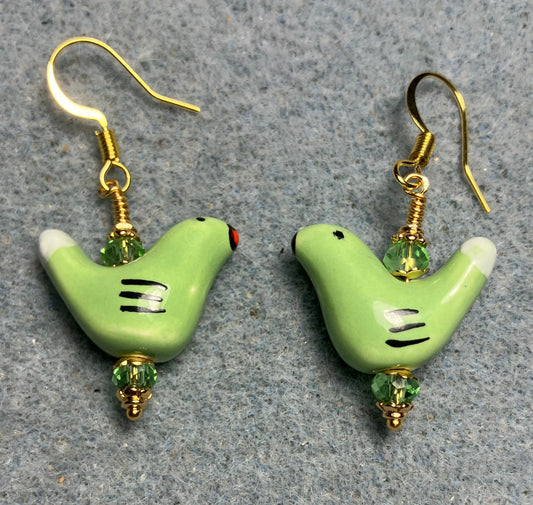 Small green and white ceramic bird bead earrings adorned with green Chinese crystal beads.