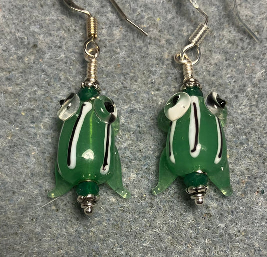 Very small green with black stripes lamp work frog bead earrings adorned with green Chinese crystal beads.