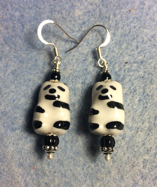 Black and white ceramic panda bear bead earrings adorned with black Czech glass beads.