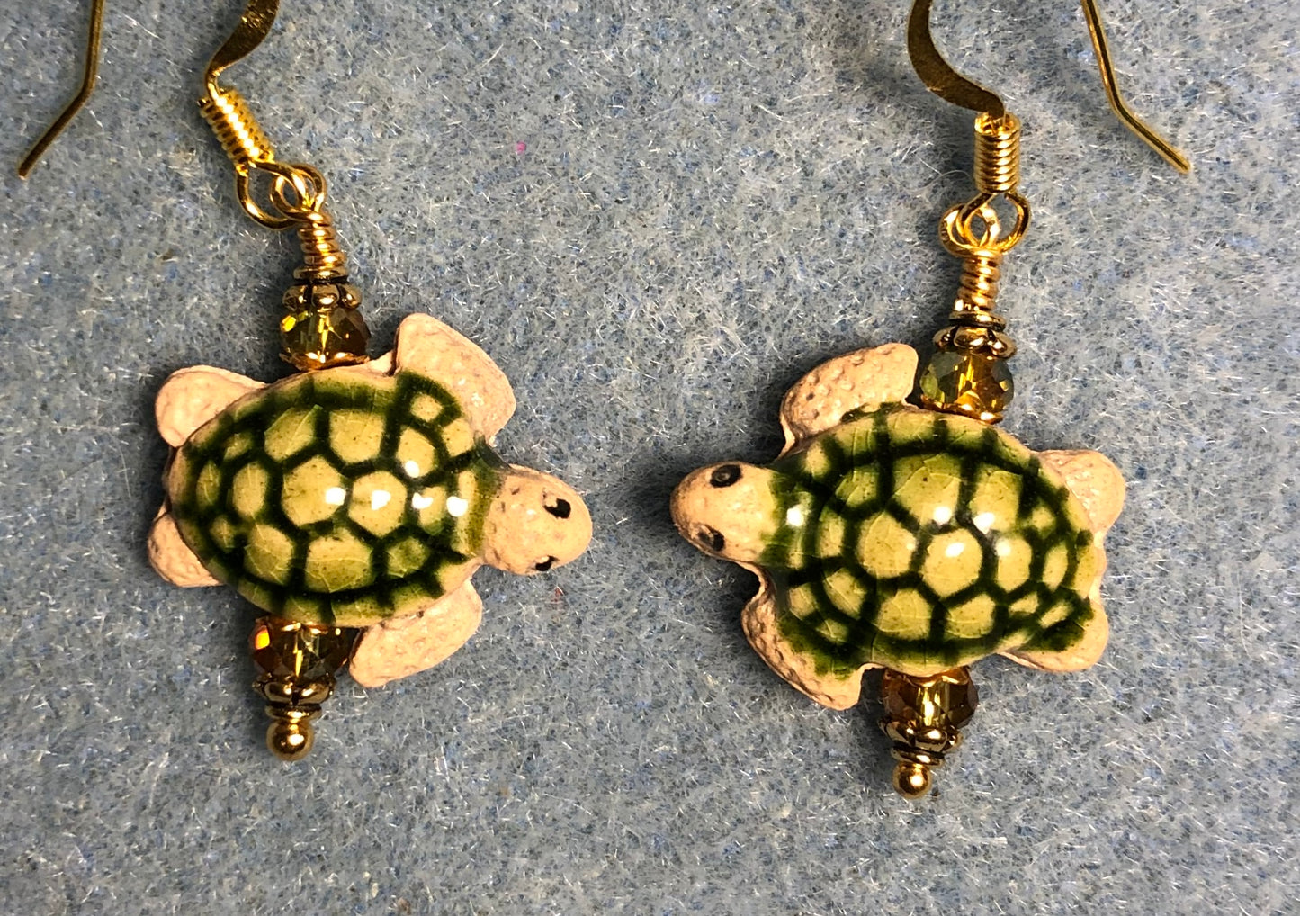 Small olive green and tan ceramic sea turtle bead earrings adorned with olive green Chinese crystal beads.