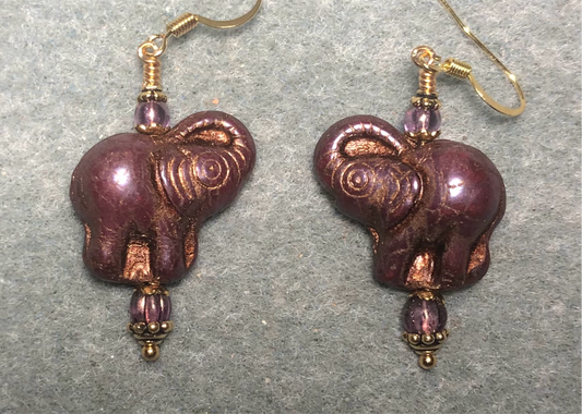Purple (with copper inlay) Czech glass elephant bead earrings adorned with purple Czech glass beads.