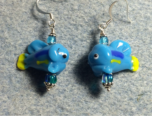 Opaque turquoise and yellow lamp work fish bead earrings adorned with turquoise Czech glass beads.