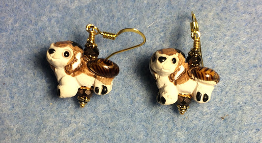 Small tan, brown, and white ceramic dog bead earrings adorned with brown Chinese crystal beads.