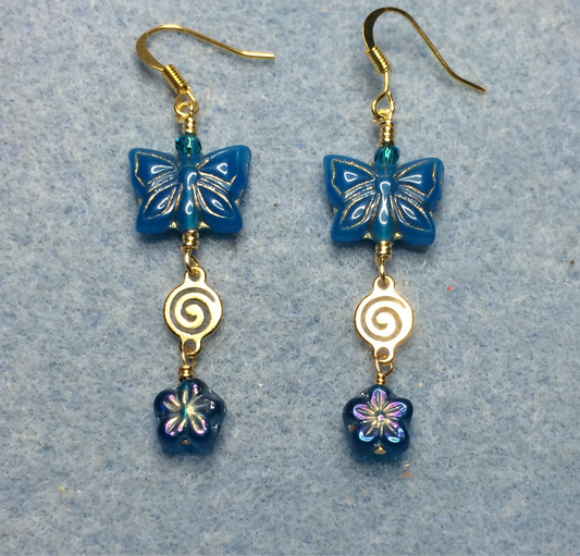 Turquoise Czech glass butterfly bead earrings adorned with gold swirly connectors and turquoise Czech glass daisy beads.