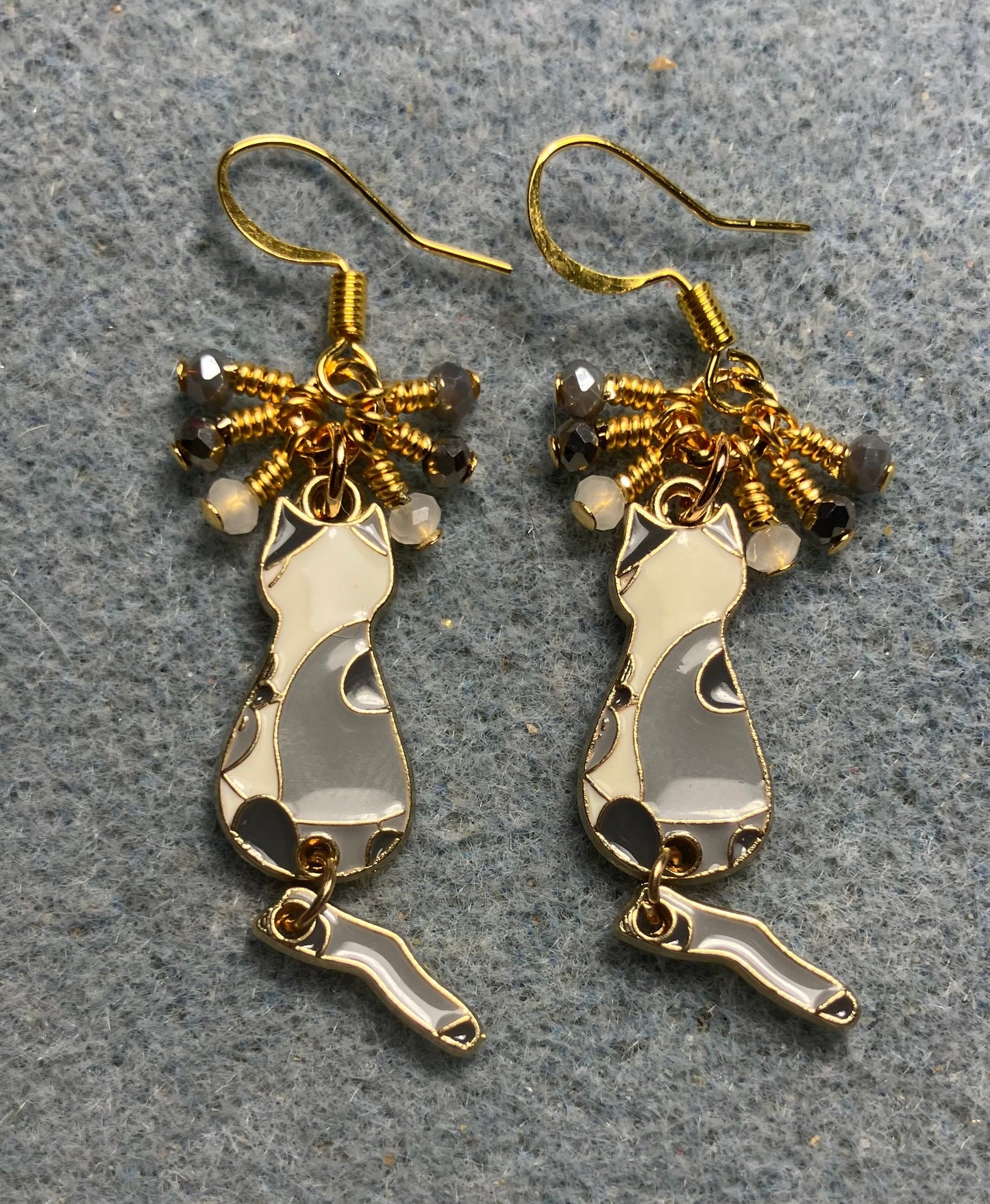 Dark gray , light gray, and white enamel cat charm earrings adorned with tiny dangling dark gray, light gray, and white Chinese crystal beads.