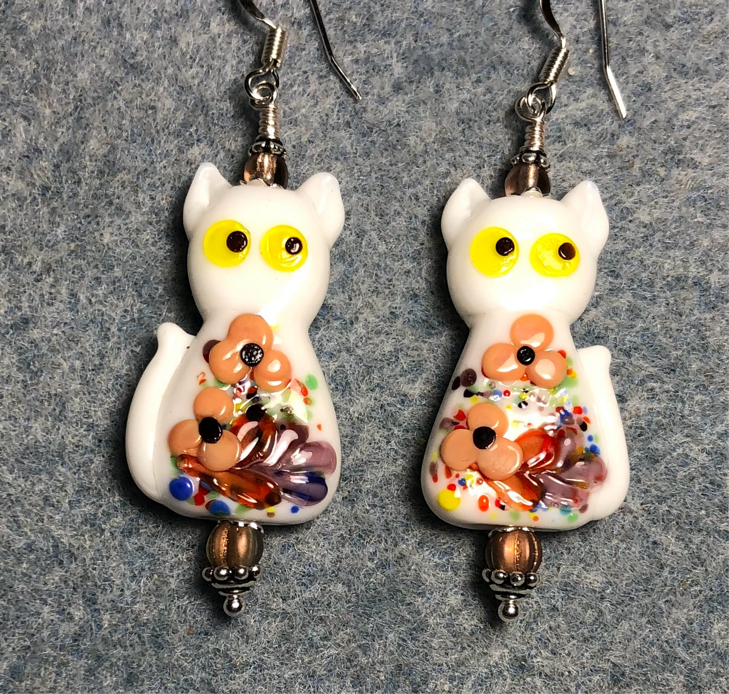 White, tan, and yellow lamp work cat bead earrings adorned with tan Czech glass beads.