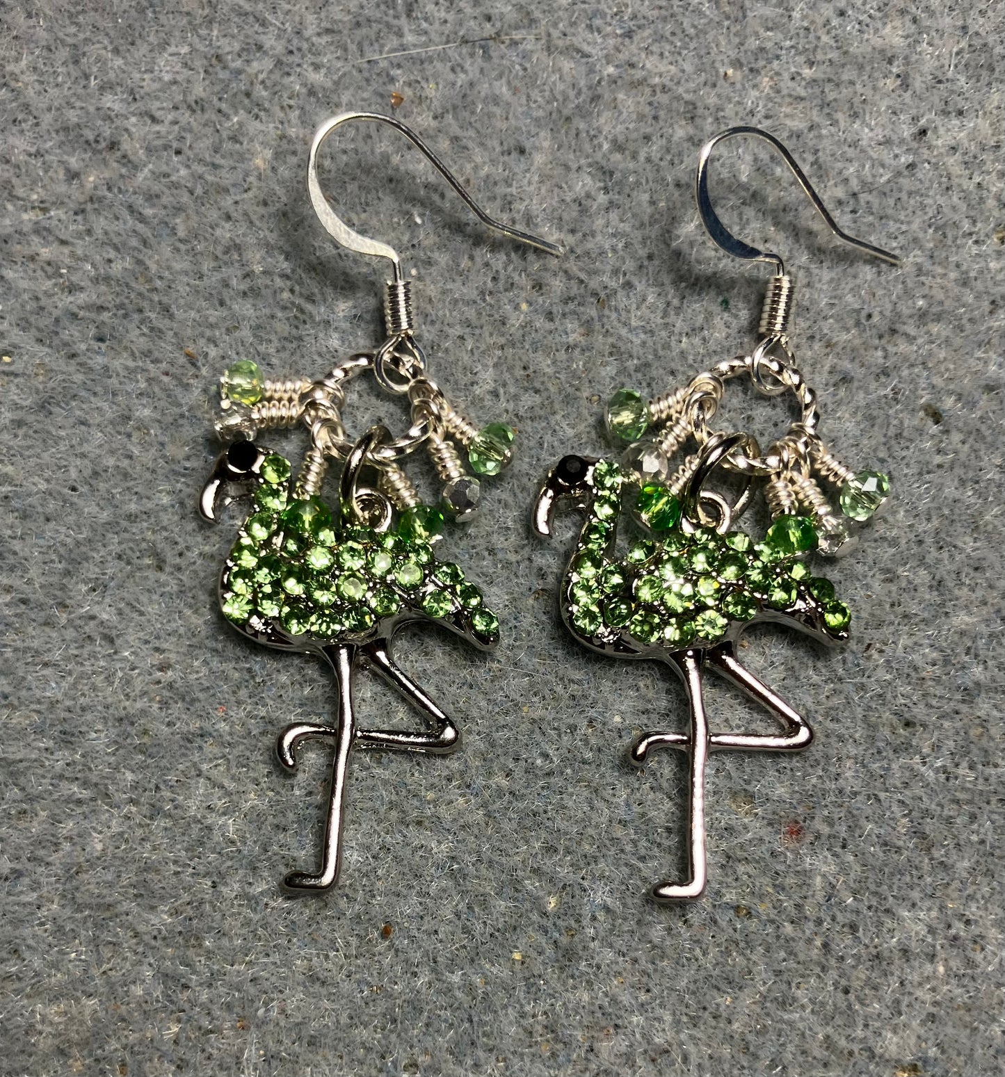 Silver and light green rhinestone flamingo charm earrings adorned with tiny dangling light green and silver Chinese crystal beads.