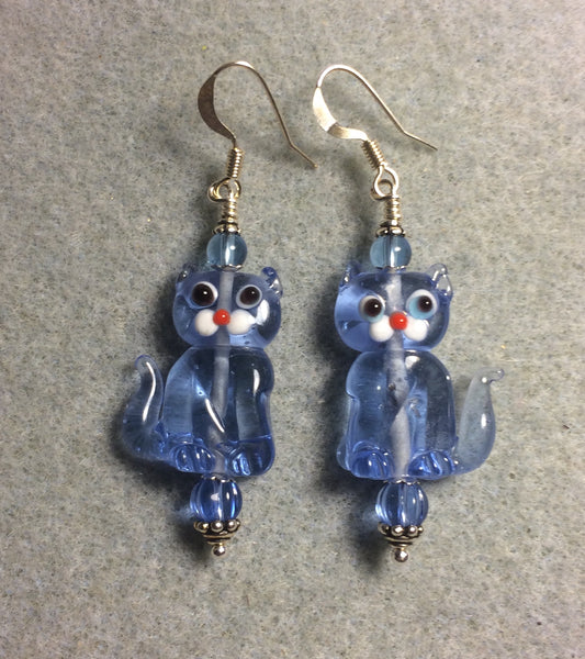 Translucent light blue lamp work cat bead earrings adorned with light blue Czech glass beads.