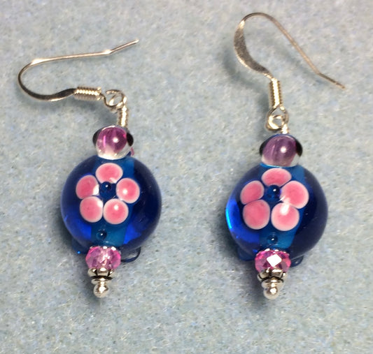 Bright blue and pink lamp work turtle bead earrings adorned with hot pink Chinese crystal beads.