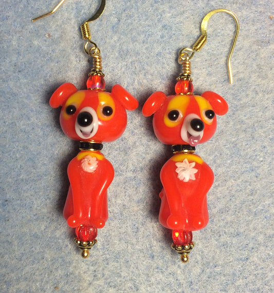 Bright red lamp work dog bead earrings adorned with black rhinestone rondelle “collars” and red Czech glass beads.