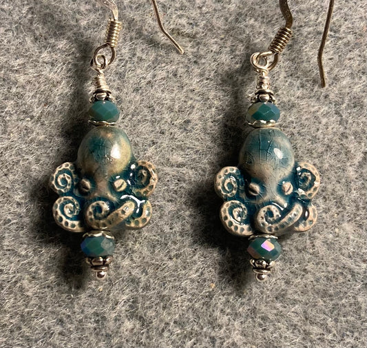 Small turquoise teal ceramic (raku) octopus bead earrings adorned with turquoise teal Chinese crystal beads.