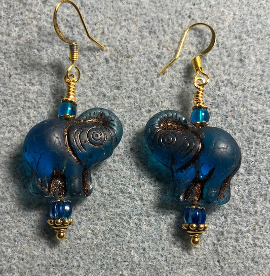 Dark turquoise (with copper inlay) Czech glass elephant bead earrings adorned with turquoise Czech glass beads.
