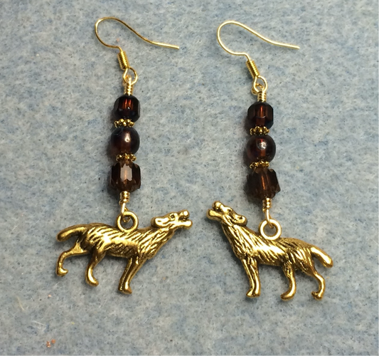 Gold wolf charm earrings adorned with brown Czech glass beads