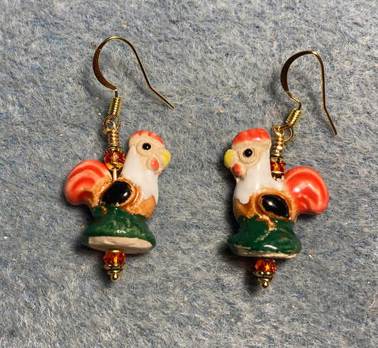 Small red, brown, and green, ceramic chicken bead earrings adorned with red Chinese crystal beads.