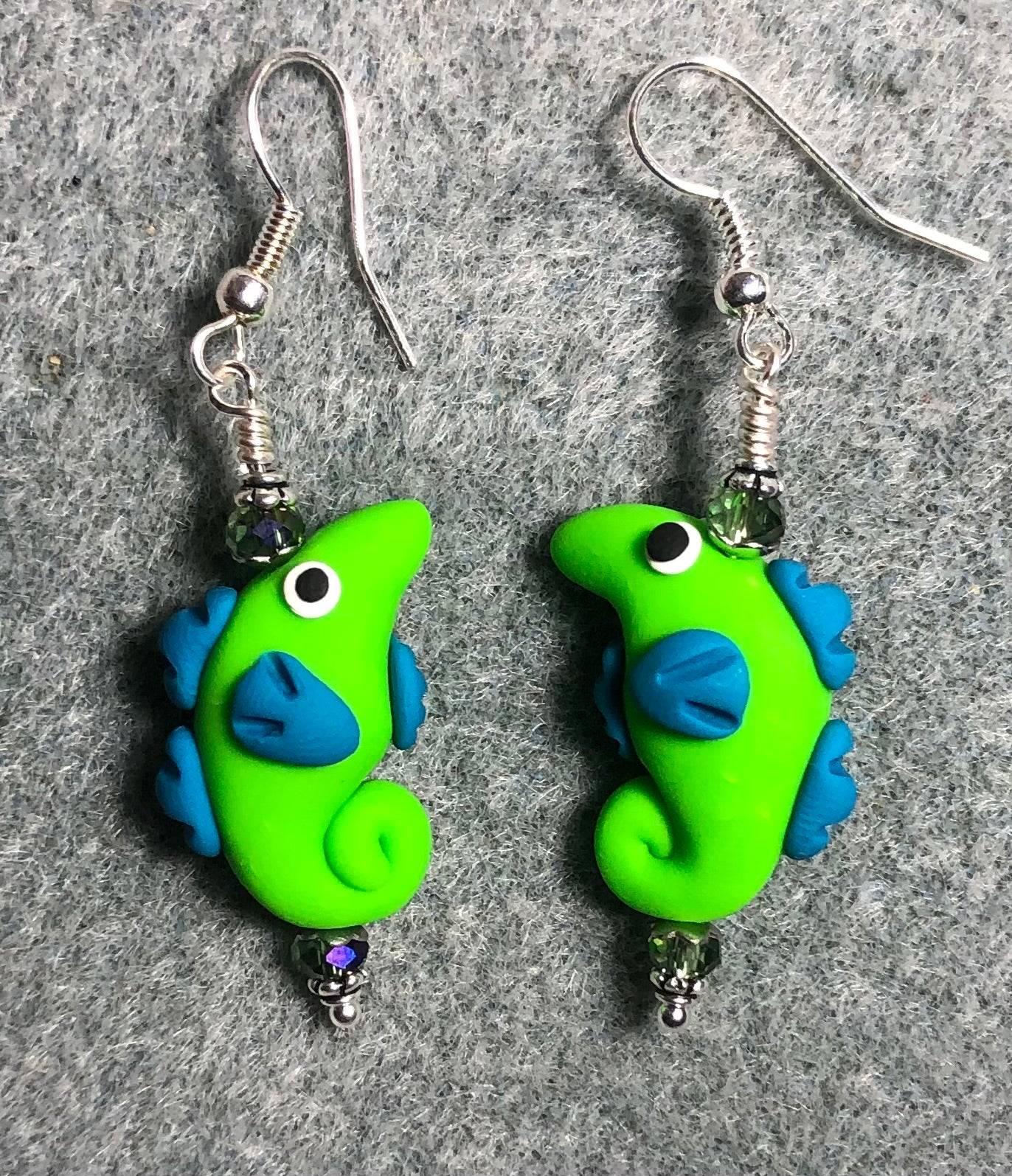 Green and turquoise polymer clay seahorse bead earrings adorned with green Chinese crystal beads.