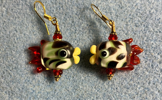 White and red lamp work spotted fish bead earrings adorned with red Chinese crystal beads.