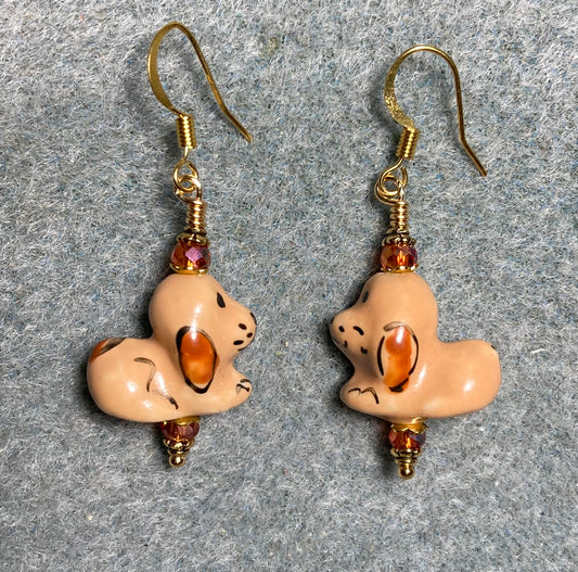 Orange brown ceramic puppy dog bead earrings adorned with orange Chinese crystal beads.