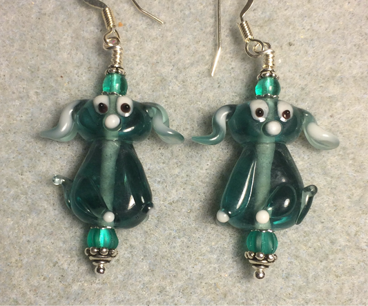 Translucent teal lamp work floppy eared puppy dog bead earrings adorned with teal Czech glass beads.