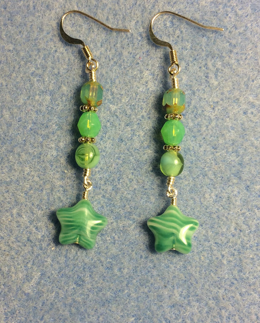 Small opaque light green Czech glass star bead earrings adorned with light green Czech glass beads.