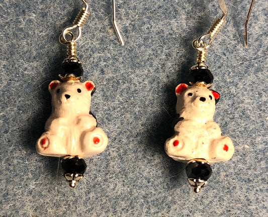 Small white and black ceramic teddy bear bead earrings adorned with black Chinese crystal beads.