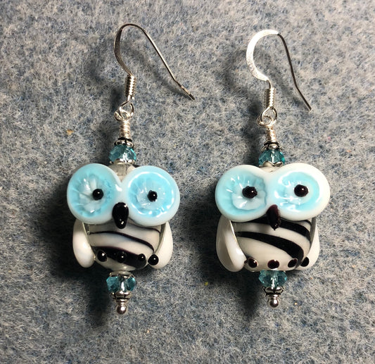 Black and turquoise lamp work owl bead earrings adorned with turquoise Chinese crystal beads.