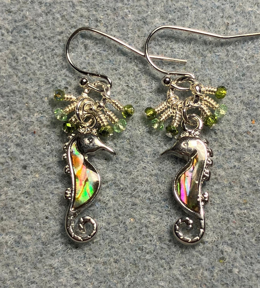 Small silver and green abalone seahorse charm earrings adorned with tiny dangling green Chinese crystal beads.