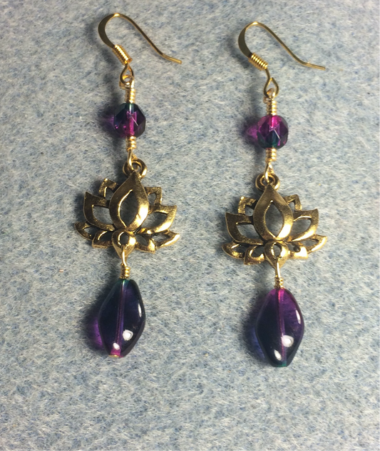 Gold lotus flower connector charm earrings adorned with purple green Czech glass twist beads and purple green Czech glass beads.