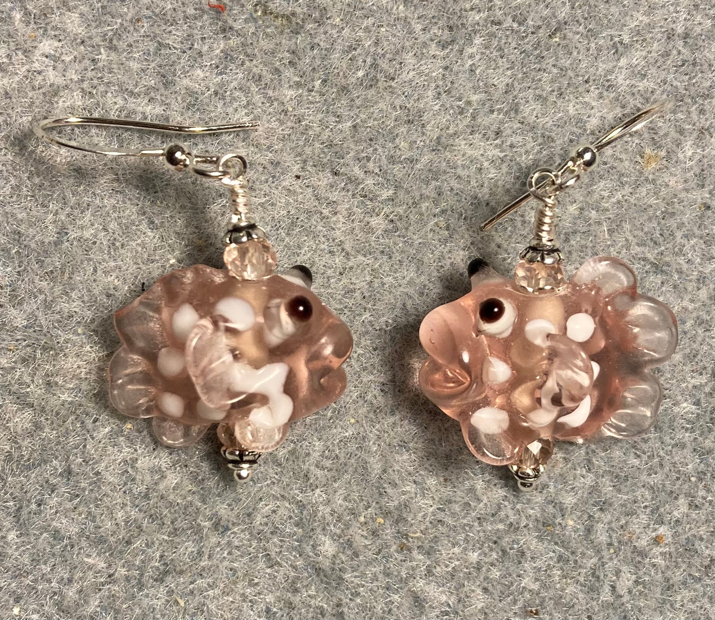 Pink spotted lamp work fish bead earrings adorned with pink Chinese crystal beads.