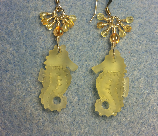 Yellow sea glass seahorse pendant bead earrings adorned with yellow Czech glass beads and small dangling yellow Czech glass beads.