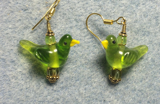 Translucent olive green lamp work songbird bead earrings adorned with olive green Czech glass beads.
